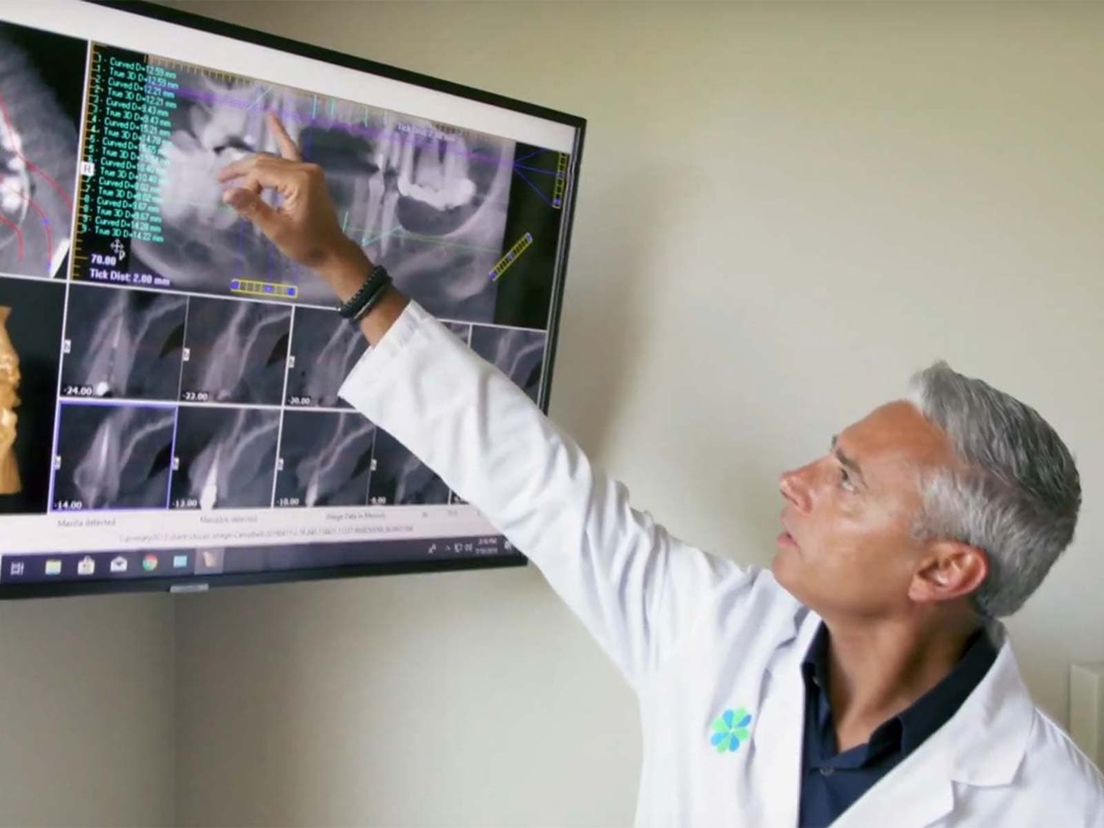 Dr. E reviewing digital implant imaging at Implants 4 Life